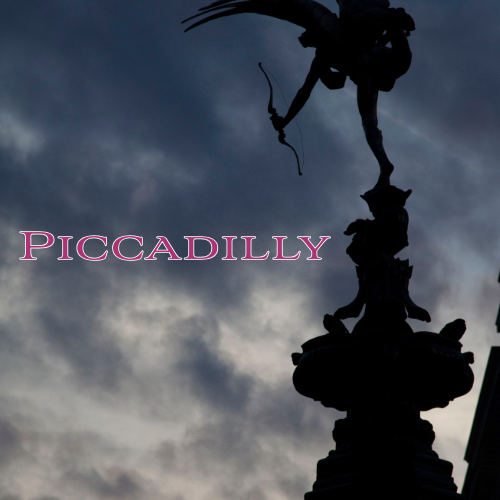 An image of the darkened statue of Eros in Piccadilly Square and the word Piccadilly.